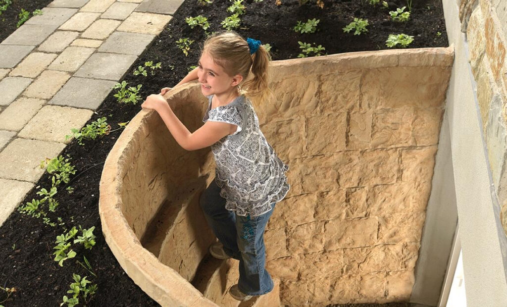 Child coming out of an egress window